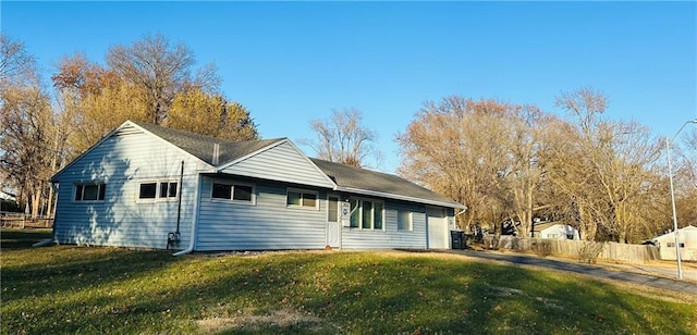 view of property exterior with a lawn