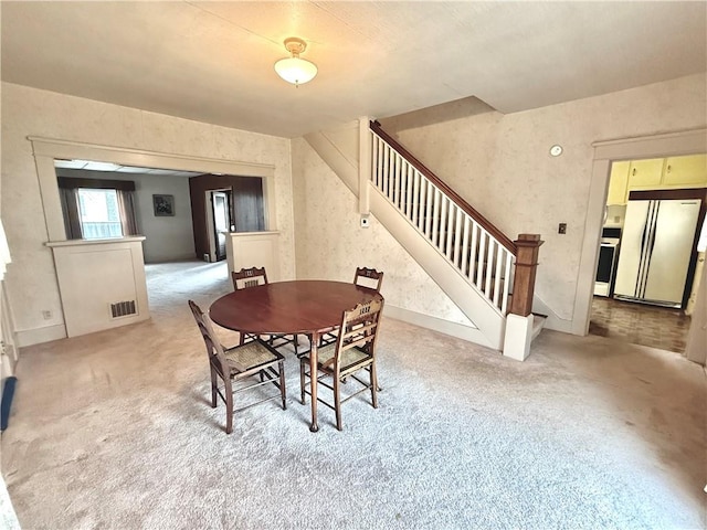 view of carpeted dining area