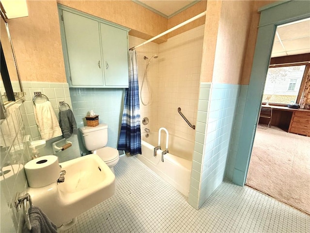 bathroom featuring toilet, tile patterned floors, tile walls, and shower / tub combo with curtain