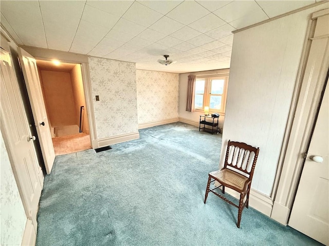 sitting room featuring light colored carpet