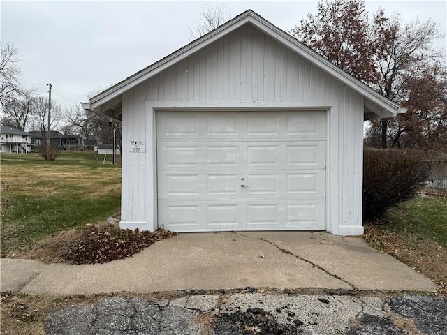 garage featuring a lawn