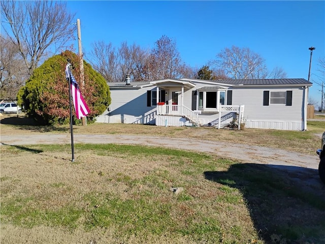 view of front of home with a front lawn and covered porch