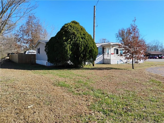 view of front of house with a porch and a front yard