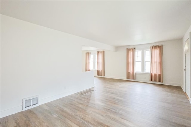 unfurnished room featuring light hardwood / wood-style flooring