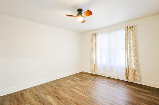 unfurnished room featuring hardwood / wood-style flooring and ceiling fan