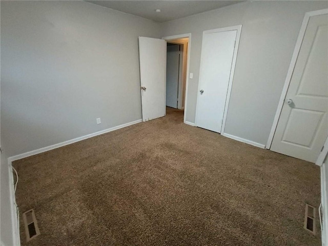 6204 Fairlane Dr, Kansas City, MO 64134 - unfurnished bedroom with carpet floors and baseboards