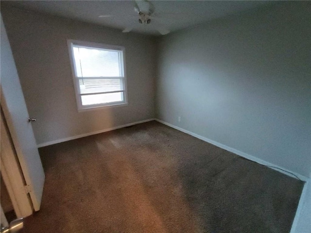 6204 Fairlane Dr, Kansas City, MO 64134 - empty room featuring dark carpet and baseboards