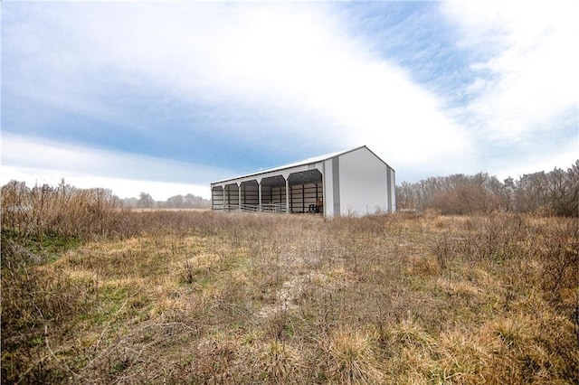 view of outbuilding with a rural view