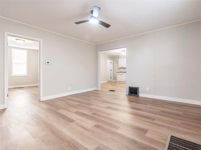 unfurnished living room with ceiling fan, light hardwood / wood-style floors, and crown molding