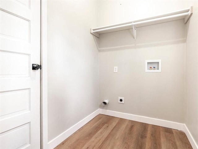 laundry area with hookup for an electric dryer, light wood-type flooring, and hookup for a washing machine