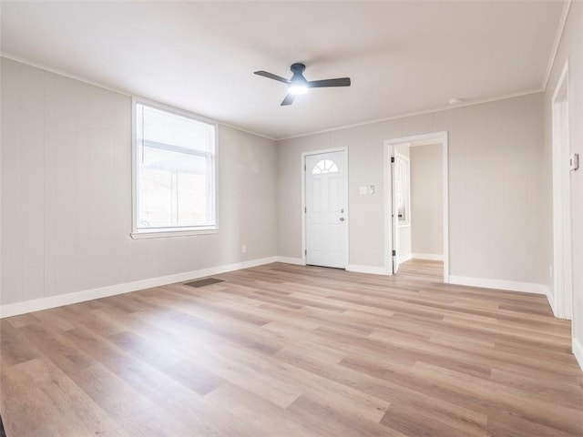 interior space featuring light hardwood / wood-style floors, ceiling fan, and ornamental molding