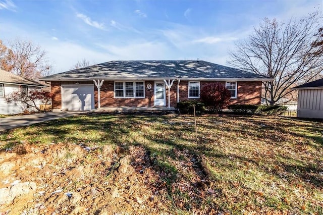 ranch-style home with a garage and a front lawn