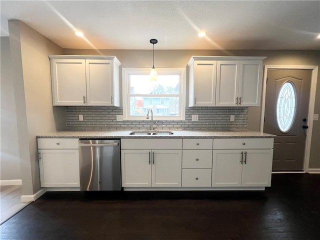 kitchen with dishwasher, white cabinets, dark wood-type flooring, and sink