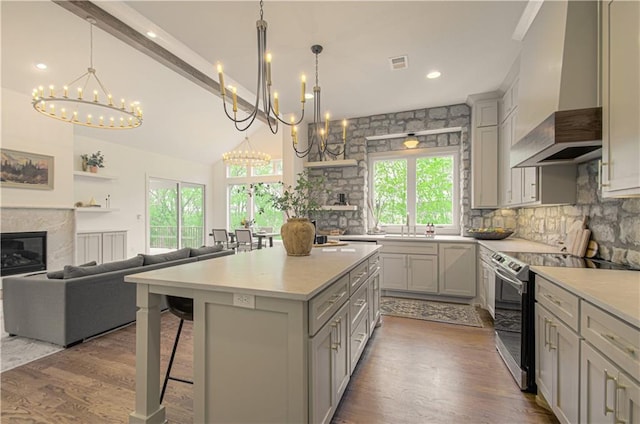 2150 NW Scenic View Dr, Riverside, MO 64150 - kitchen featuring a chandelier, stainless steel range with electric stovetop, gray cabinetry, recessed lighting, and high vaulted ceiling
