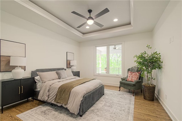 2150 NW Scenic View Dr, Riverside, MO 64150 - bedroom with a tray ceiling, wood finished floors, recessed lighting, a ceiling fan, and ornamental molding