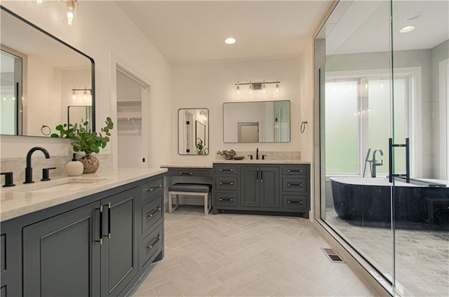 2150 NW Scenic View Dr, Riverside, MO 64150 - bathroom with two vanities, a soaking tub, a shower stall, and recessed lighting