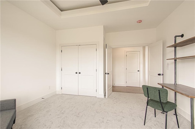2150 NW Scenic View Dr, Riverside, MO 64150 - carpeted home office with a tray ceiling and baseboards