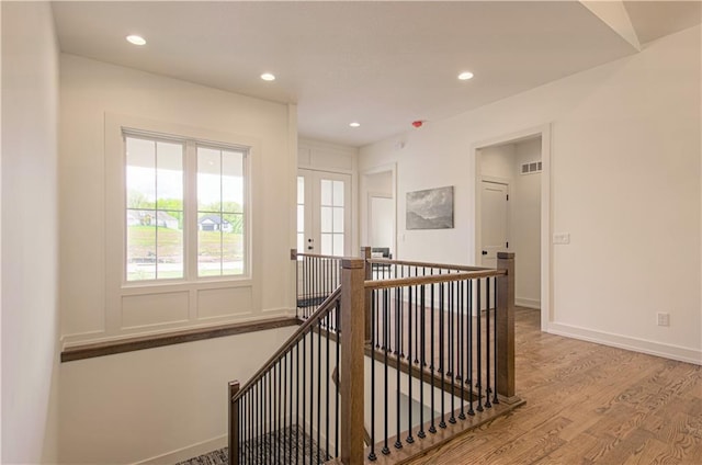 2150 NW Scenic View Dr, Riverside, MO 64150 - hall featuring an upstairs landing, wood finished floors, and recessed lighting