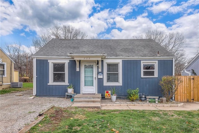 bungalow-style house with a front lawn