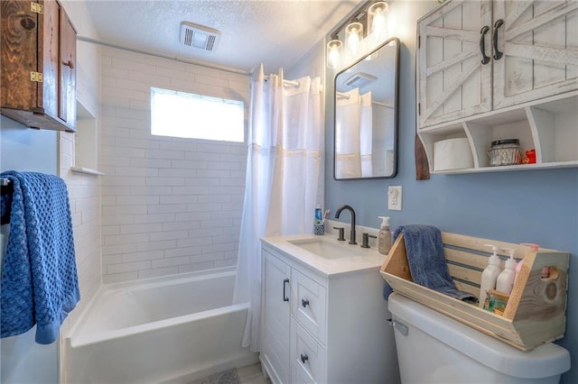 full bathroom with vanity, a textured ceiling, toilet, and shower / bath combo with shower curtain