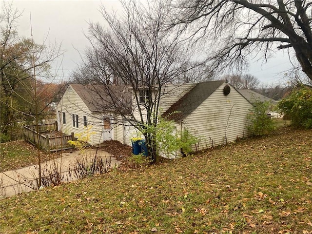 view of side of home featuring a yard