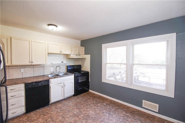 kitchen featuring black appliances, backsplash, white cabinetry, and sink