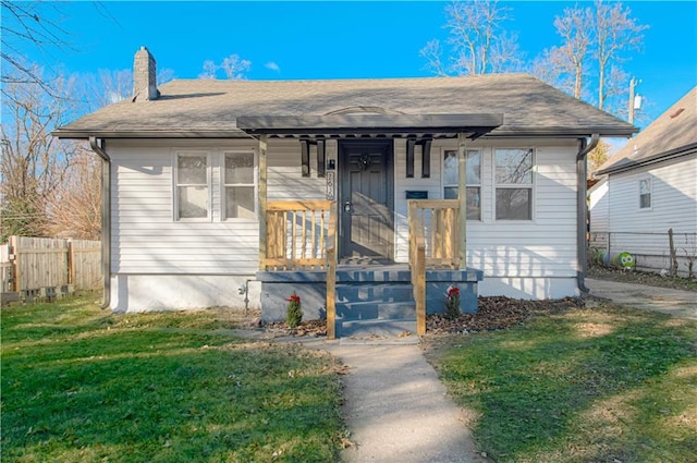 bungalow-style house with a front yard