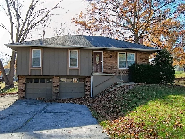 view of front of property with a garage and a front lawn