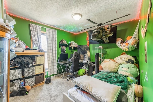 bedroom featuring carpet and a textured ceiling