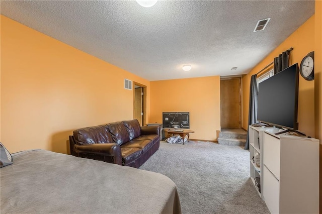 carpeted living room with a textured ceiling