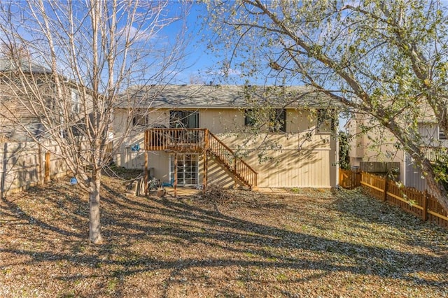 back of house with a wooden deck