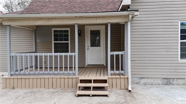 doorway to property featuring covered porch