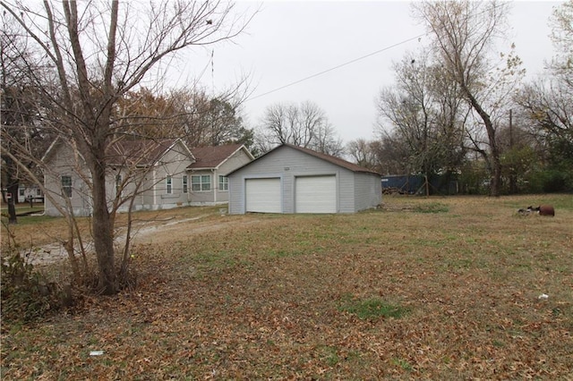 311 W Larch St, Cherokee, KS 66724 - view of yard featuring a garage and an outdoor structure