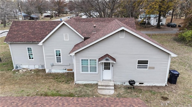 311 W Larch St, Cherokee, KS 66724 - rear view of property with crawl space and a shingled roof