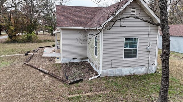 311 W Larch St, Cherokee, KS 66724 - view of home's exterior with roof with shingles and a lawn