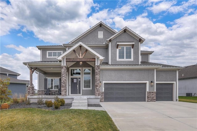 craftsman-style house featuring a porch, central AC unit, a front yard, and a garage