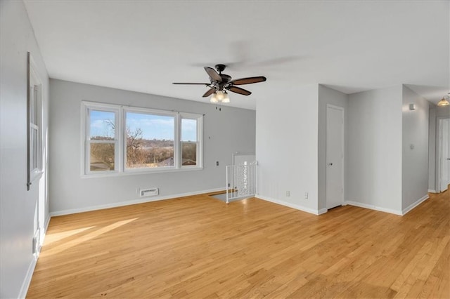 spare room featuring ceiling fan and light wood-type flooring