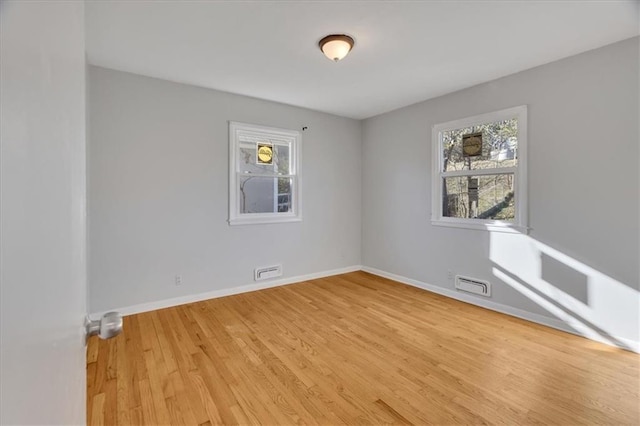 empty room with light wood-type flooring