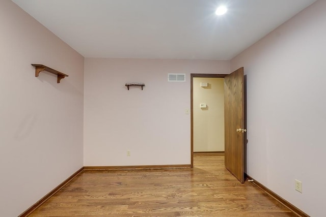 unfurnished room featuring light wood-type flooring