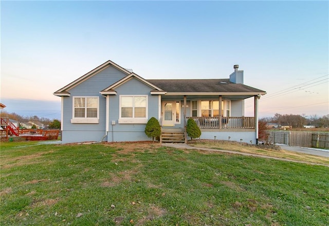 view of front of home featuring a yard and a porch