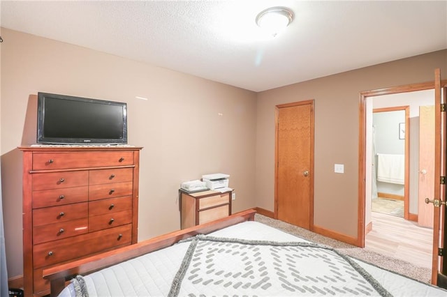 bedroom featuring light wood-type flooring