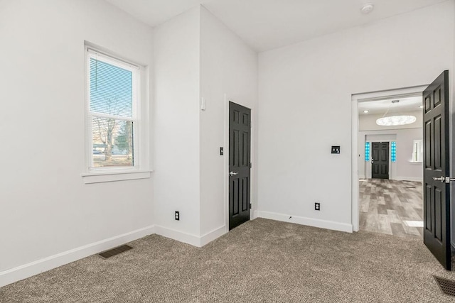 spare room featuring carpet floors