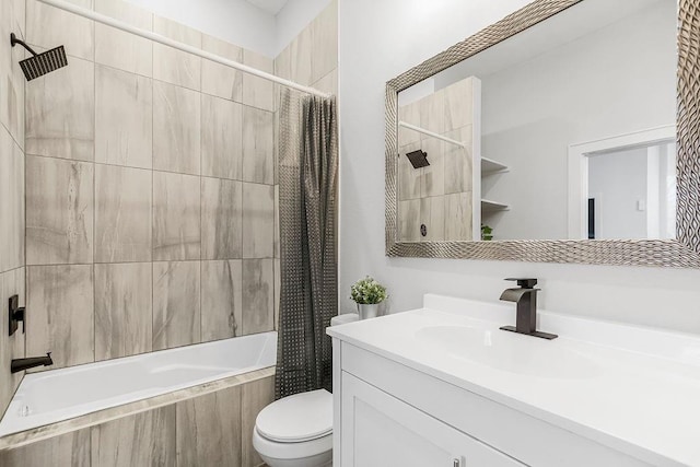 full bathroom featuring shower / tub combo with curtain, vanity, and toilet