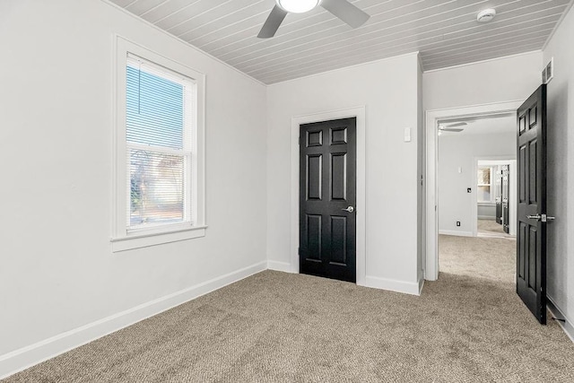 unfurnished room with light carpet, ceiling fan, and wooden ceiling