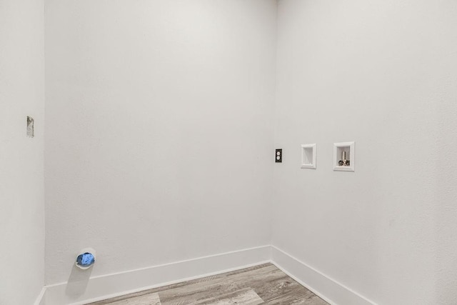 washroom with hardwood / wood-style floors and washer hookup