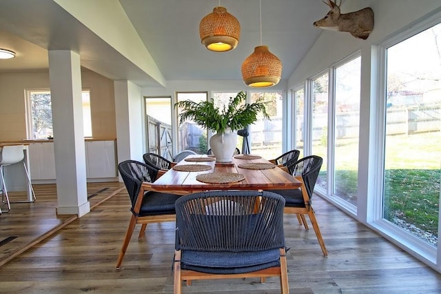 sunroom / solarium with vaulted ceiling