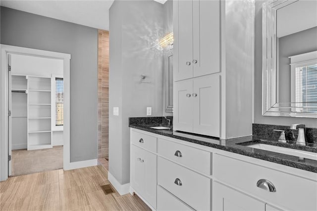 bathroom featuring vanity and hardwood / wood-style flooring