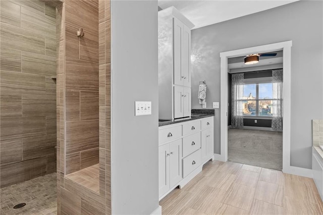 bathroom with a shower and vanity