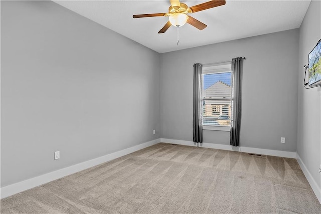 unfurnished room with light carpet and ceiling fan