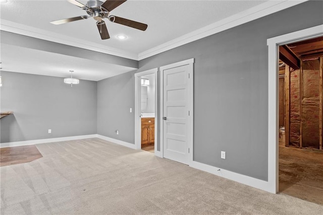 interior space featuring light colored carpet, ceiling fan, and ornamental molding